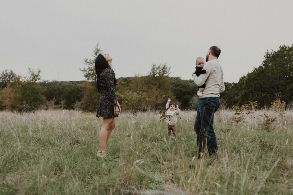 Family looking at the sky together during their Texas hill country family photos.