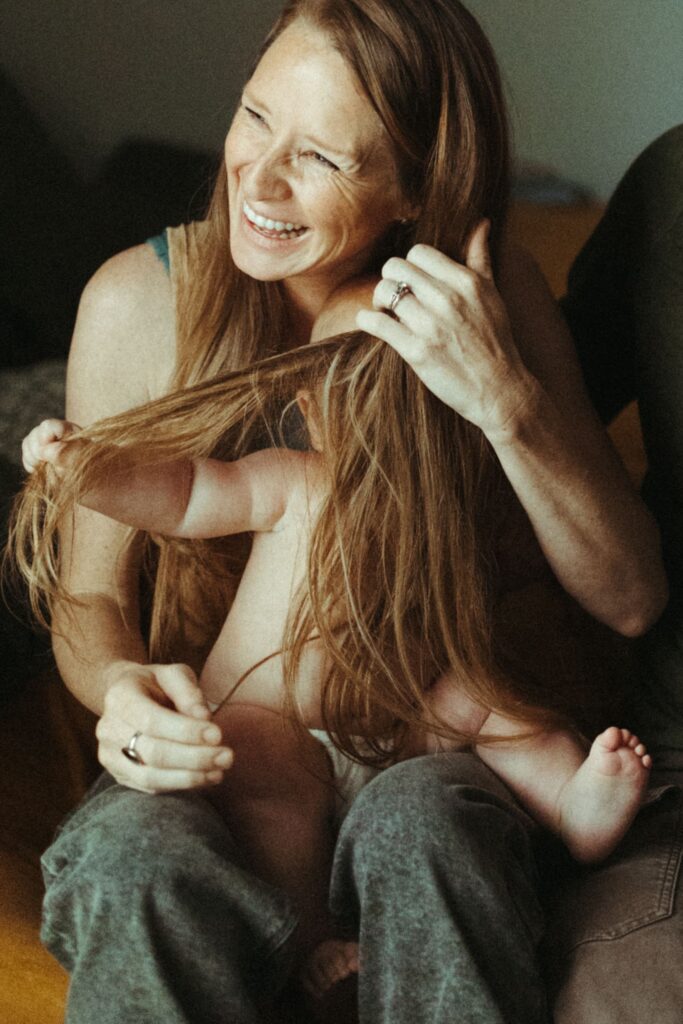 Baby pulling Mom's Hair during their family photos in Austin Texas